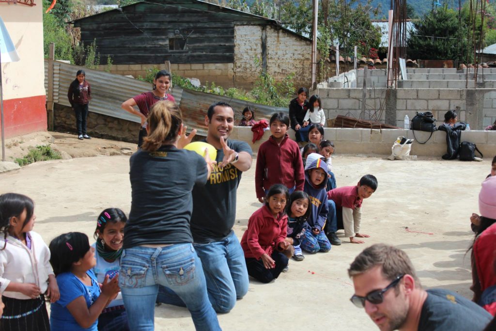 Syed Playing with kids in school that we built in Guatemala with Pencils of Promise.