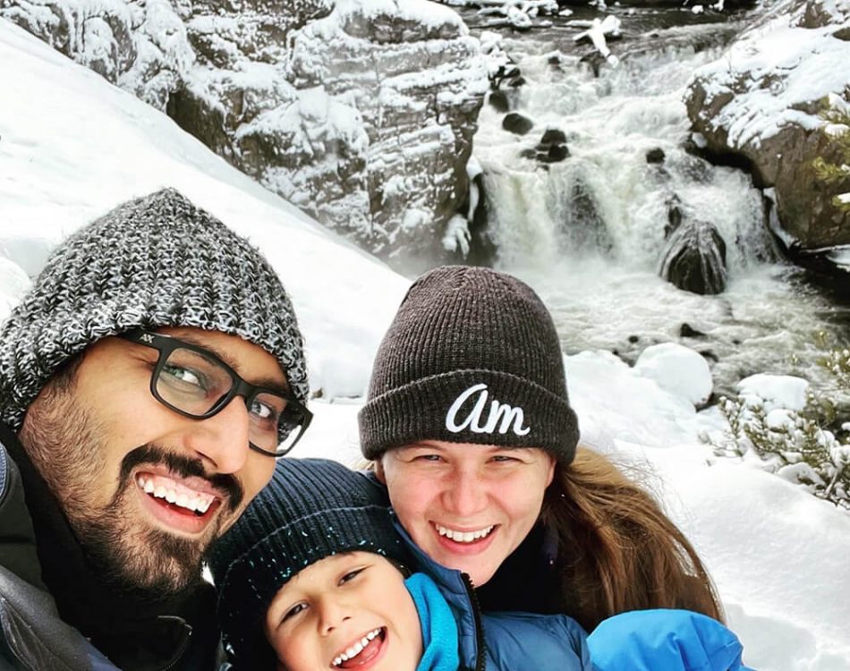 Family selfie at a Yellowstone waterfall