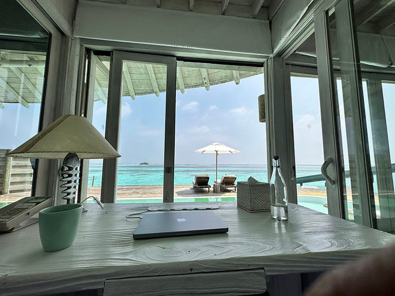 My work station in Maldives - Coffee, Water, and Beautiful Views
