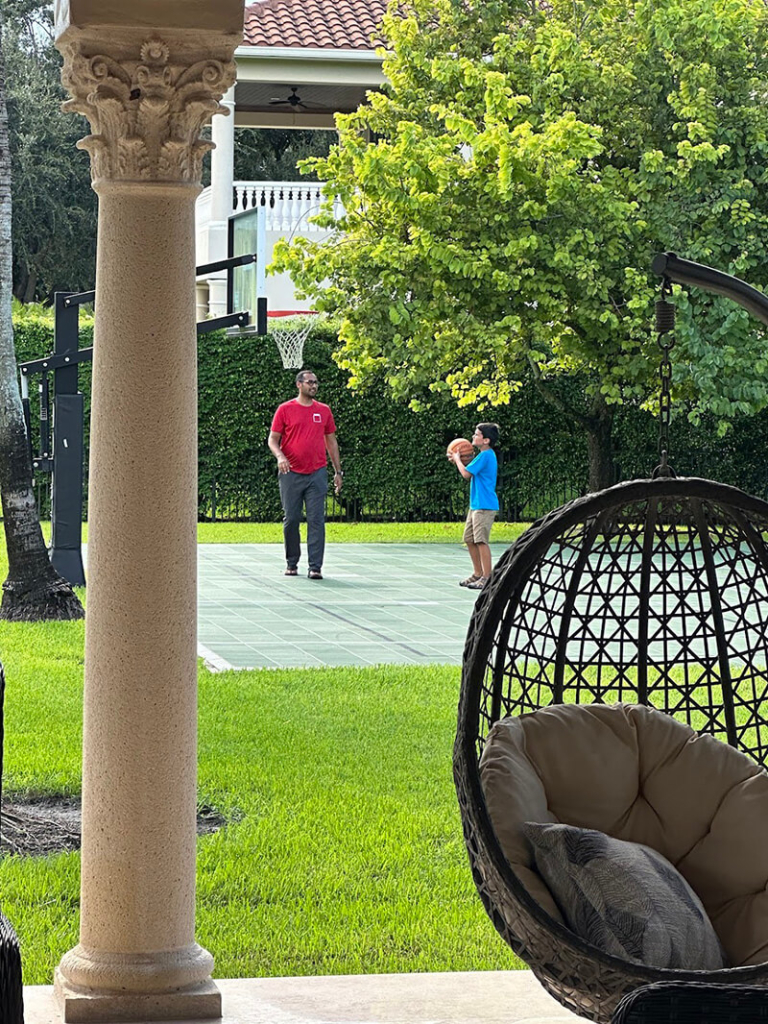 Helping Solomon practice Basketball